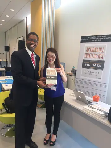 Reader holding Actionable Intelligence in Singapore, April 2016