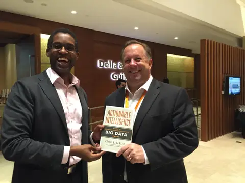 Reader holding Actionable Intelligence in Singapore, November 2015
