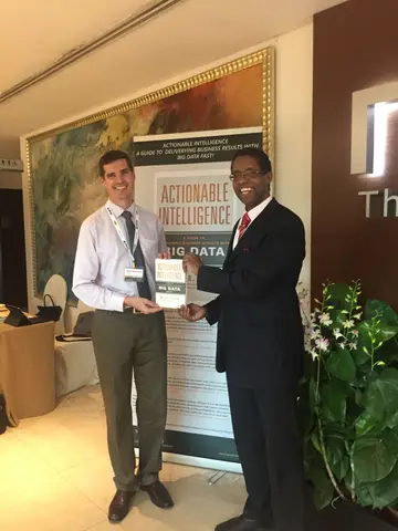 Reader holding Actionable Intelligence in Singapore, March 2016