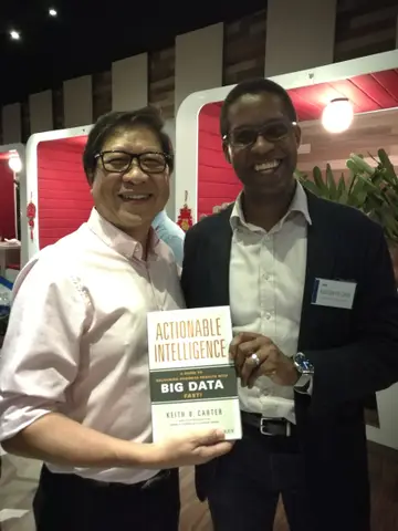 Reader holding Actionable Intelligence in February 2018