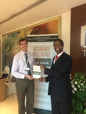 Reader holding Actionable Intelligence in Singapore, March 2016