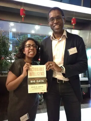 Reader holding Actionable Intelligence in February 2018