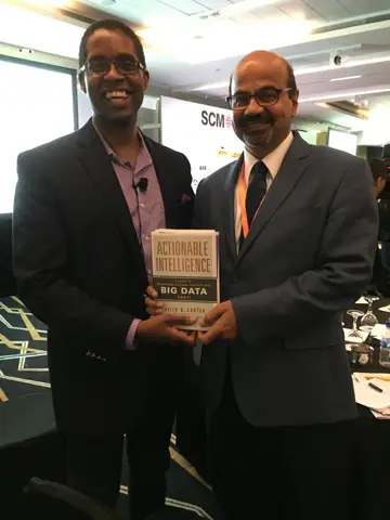 Reader holding Actionable Intelligence in Singapore, June 2015