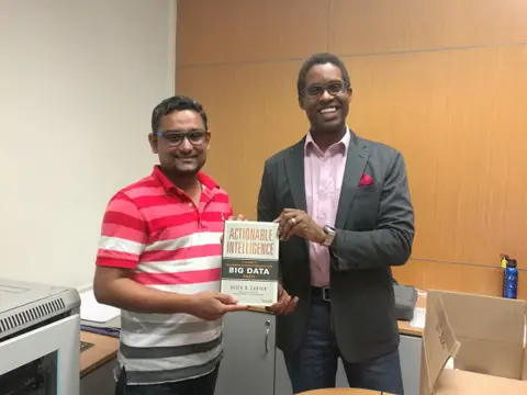 Reader holding Actionable Intelligence in Singapore, September 2017