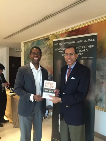 Reader holding Actionable Intelligence in Singapore, March 2016