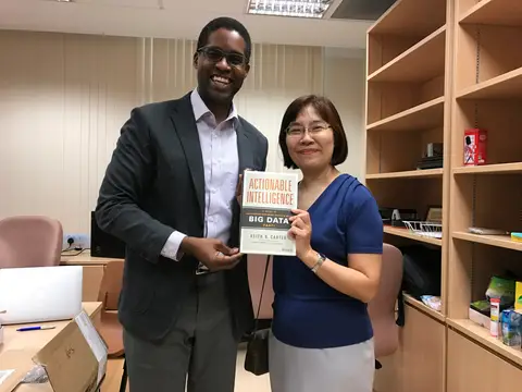 Reader holding Actionable Intelligence in Singapore, March 2017
