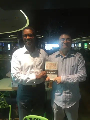 Reader holding Actionable Intelligence in Singapore, March 2016