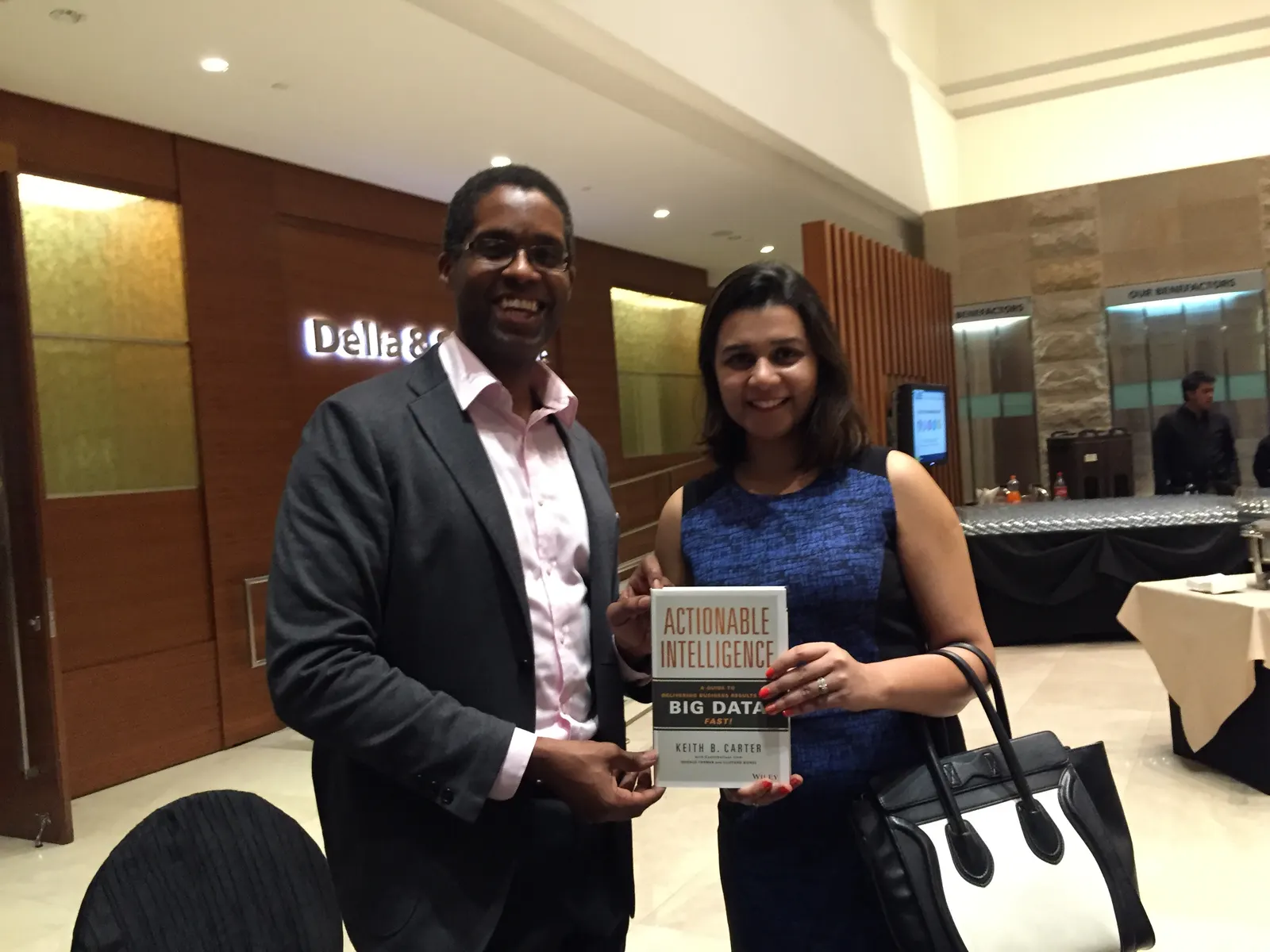 Reader holding Actionable Intelligence in Singapore, November 2015