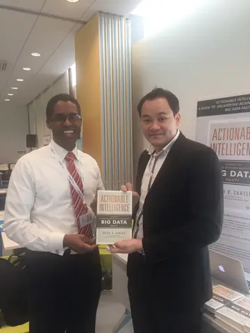 Reader holding Actionable Intelligence in Singapore, April 2016