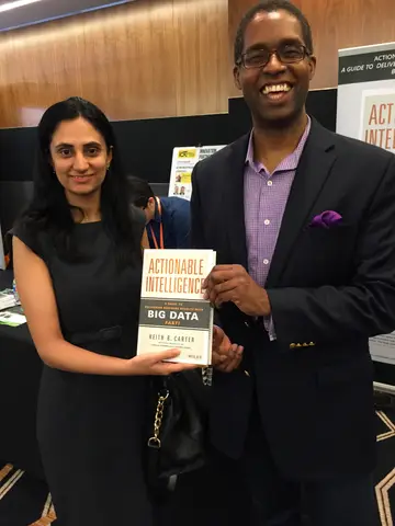 Reader holding Actionable Intelligence in Singapore, June 2015