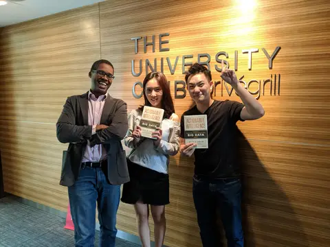 Reader holding Actionable Intelligence in Singapore, August 2018
