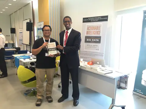 Reader holding Actionable Intelligence in Singapore, April 2016