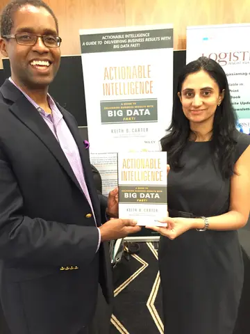 Reader holding Actionable Intelligence in Singapore, June 2015
