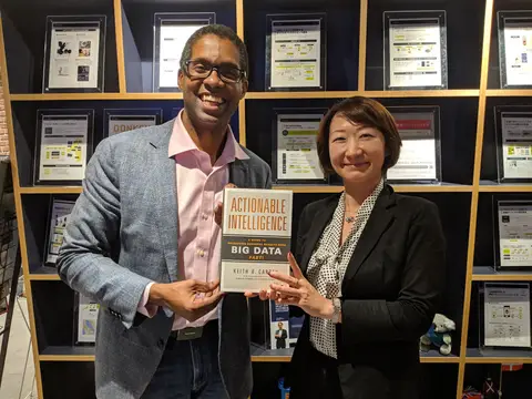 Reader holding Actionable Intelligence in Shibuya, Tokyo, Japan, May 2019