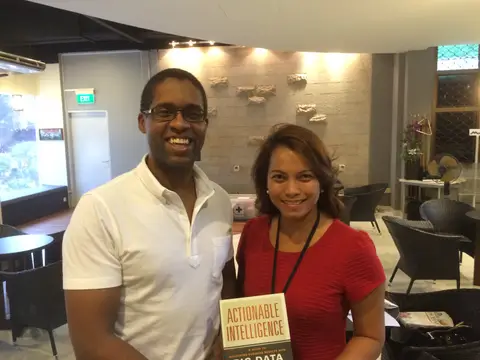Reader holding Actionable Intelligence in October 2014