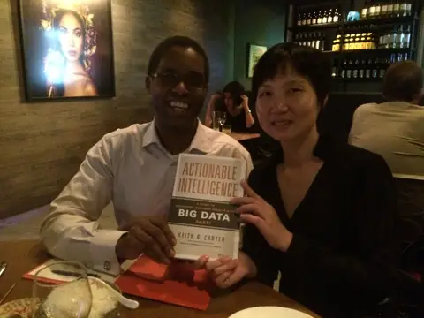 Reader holding Actionable Intelligence in November 2014