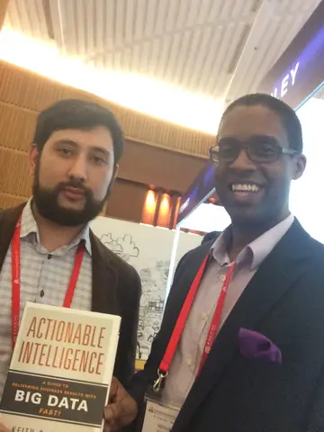 Reader holding Actionable Intelligence in April 2015