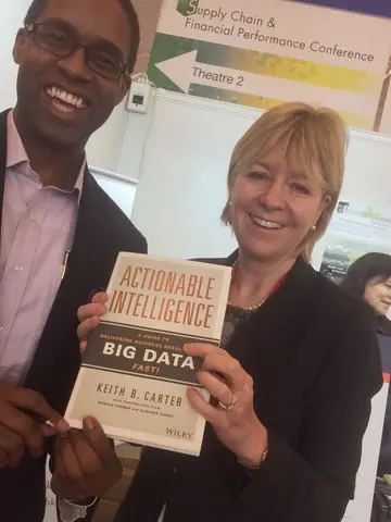 Reader holding Actionable Intelligence in Hong Kong, April 2015