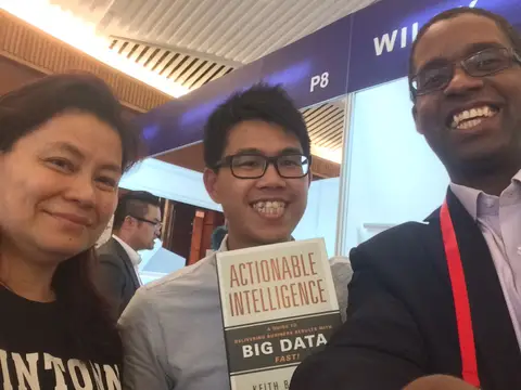 Reader holding Actionable Intelligence in Hong Kong, April 2015