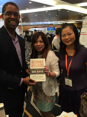 Reader holding Actionable Intelligence in Singapore, June 2015
