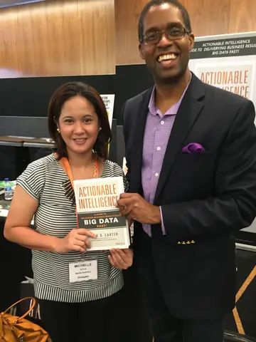Reader holding Actionable Intelligence in Singapore, June 2015