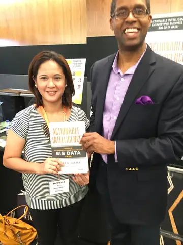 Reader holding Actionable Intelligence in Singapore, June 2015