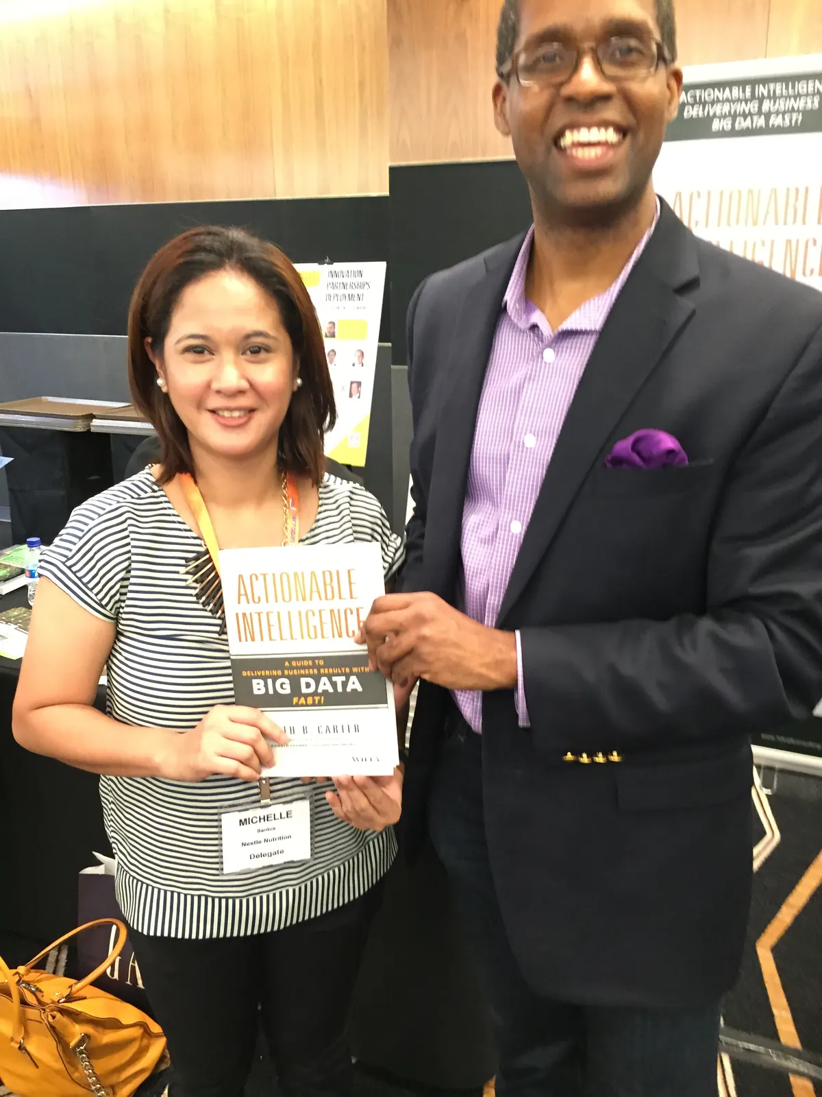 Reader holding Actionable Intelligence in Singapore, June 2015