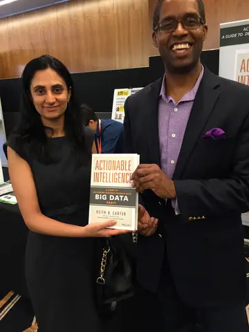 Reader holding Actionable Intelligence in Singapore, June 2015