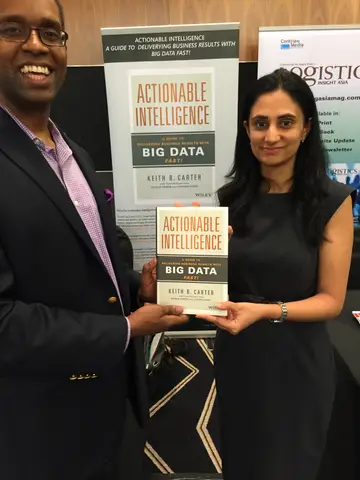 Reader holding Actionable Intelligence in Singapore, June 2015