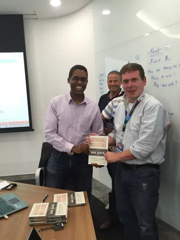 Reader holding Actionable Intelligence in Singapore, October 2015