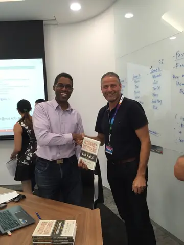 Reader holding Actionable Intelligence in Singapore, October 2015
