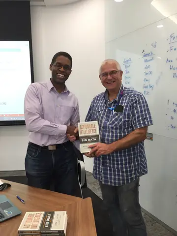 Reader holding Actionable Intelligence in Singapore, October 2015
