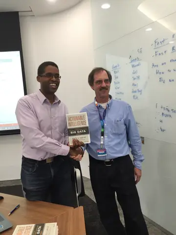 Reader holding Actionable Intelligence in Singapore, October 2015