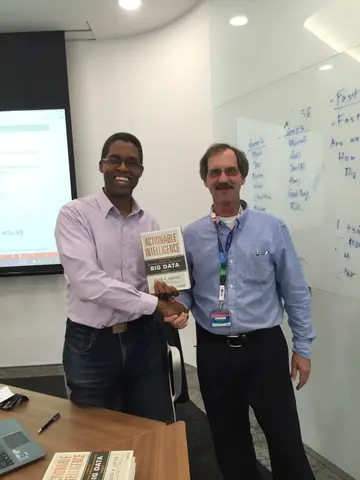 Reader holding Actionable Intelligence in Singapore, October 2015