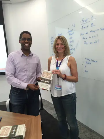 Reader holding Actionable Intelligence in Singapore, October 2015