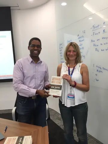 Reader holding Actionable Intelligence in Singapore, October 2015