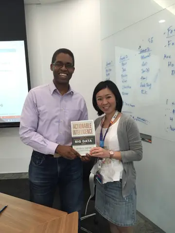Reader holding Actionable Intelligence in Singapore, October 2015