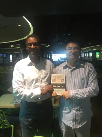 Reader holding Actionable Intelligence in Singapore, March 2016