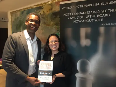 Reader holding Actionable Intelligence in Singapore, March 2016