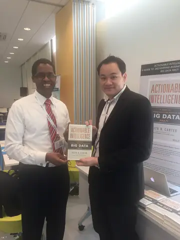 Reader holding Actionable Intelligence in Singapore, April 2016