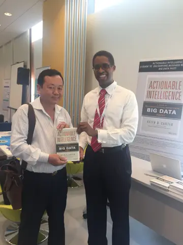 Reader holding Actionable Intelligence in Singapore, April 2016
