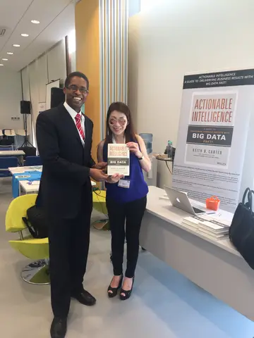 Reader holding Actionable Intelligence in Singapore, April 2016