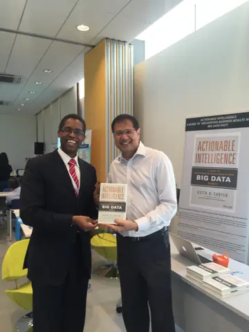Reader holding Actionable Intelligence in Singapore, April 2016