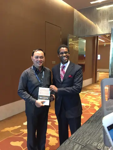 Reader holding Actionable Intelligence in Singapore, October 2016