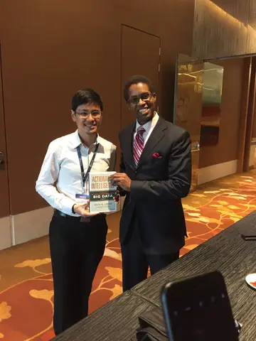 Reader holding Actionable Intelligence in Singapore, October 2016
