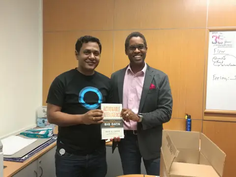 Reader holding Actionable Intelligence in Singapore, September 2017