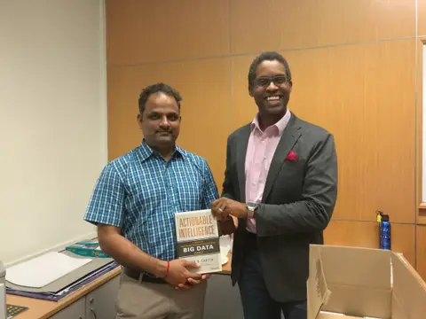 Reader holding Actionable Intelligence in Singapore, September 2017