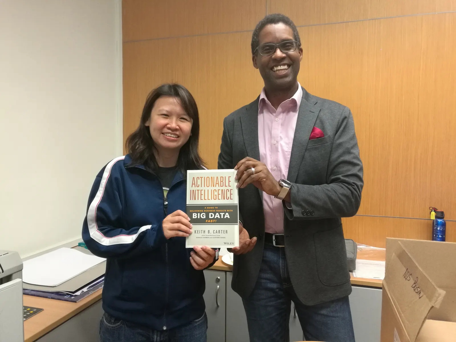 Reader holding Actionable Intelligence in Singapore, September 2017